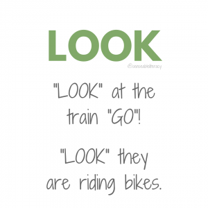 image stating "LOOK", "LOOK at the train "GO"!, and "LOOK" they are riding bikes.