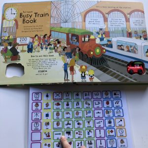 picture of the first page of the "Busy Train" book and a core vocabulary communication board with a finger modeling/pointing to the word/symbol "GO".