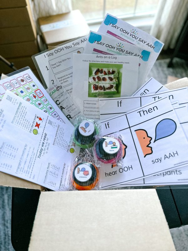 image showing the items included within the "I Say OOH You Say AAH" Sensory Based Literacy Kit