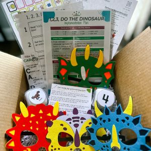 image of the items included within the sensory based literacy kit featuring "1,2,3, Do the Dinosaur"